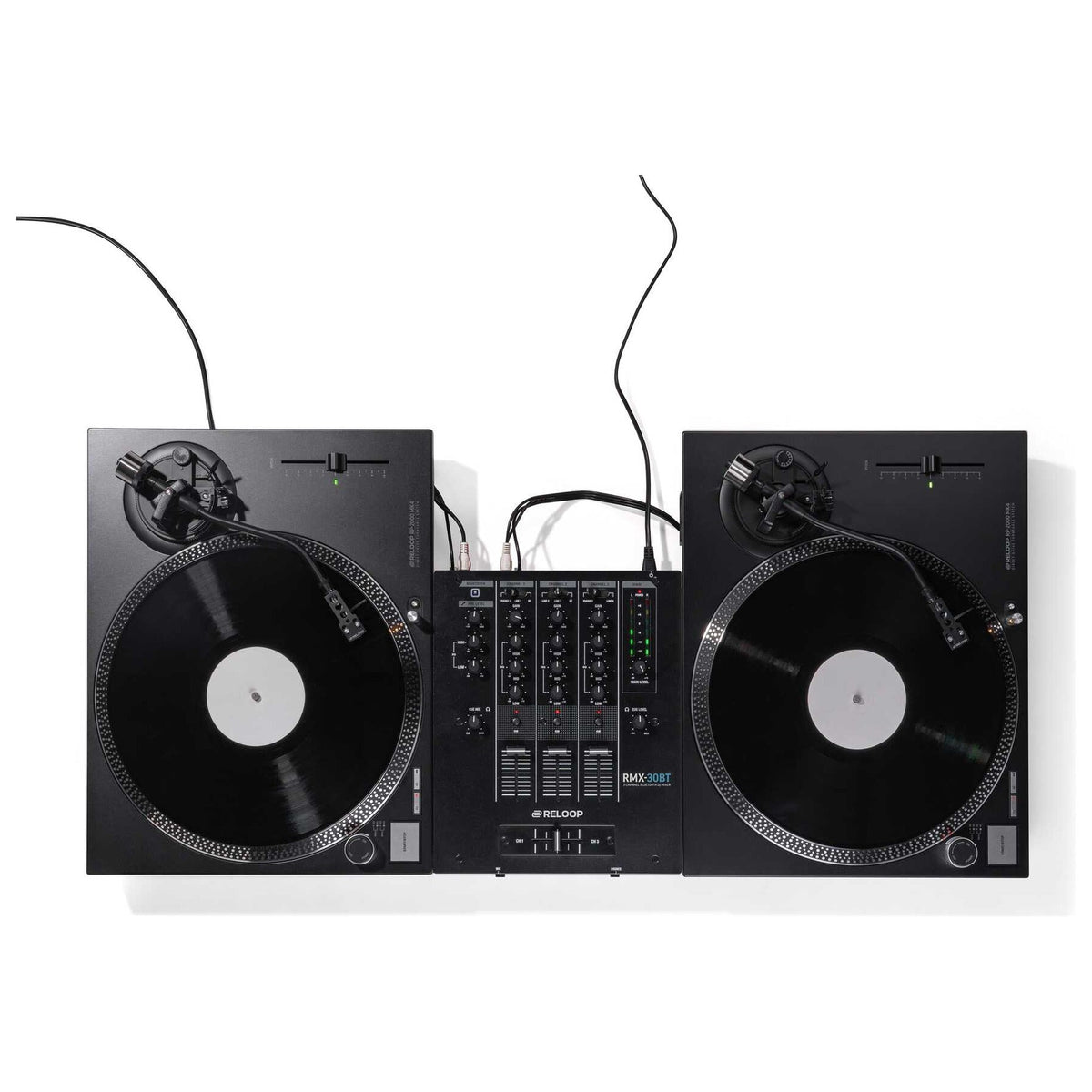 Two Reloop RP-2000 MK4 turntables set up in battle position with a mixer