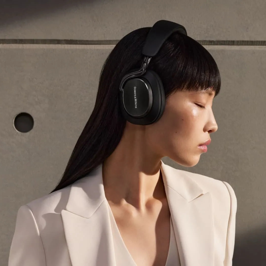 Bowers & Wilkins Px8 S2 wireless headphones with sleek black design and over-ear cushioned cups, viewed from the side.