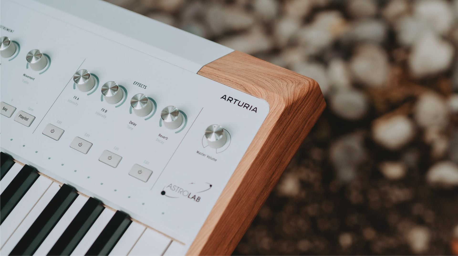 Arturia AstroLab 61 performance keyboard with black and white keys, compact design, and control knobs for music production.