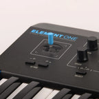 Modal Electronics Element One keyboard synthesizer with a compact design and control knobs, featuring a digital display and various connection ports.