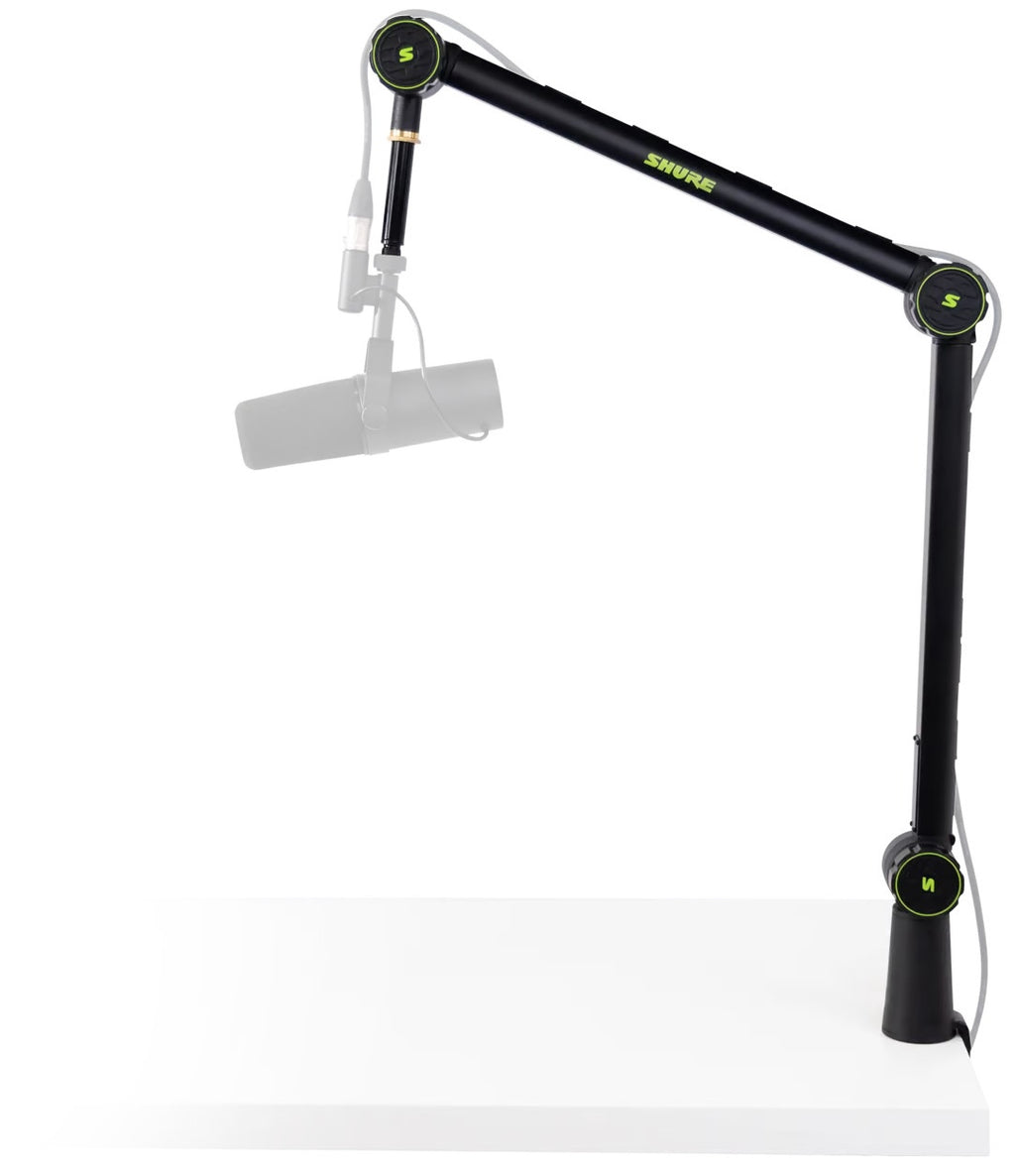 Shure SH-BROADCAST1 broadcast microphone arm mounted on a desk with microphone attached for studio broadcasting setup.