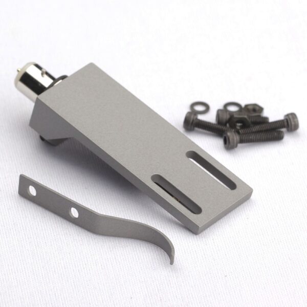 Tonar Headshell Top Q for cartridge accessories, close-up of black headshell with mounting hardware on a turntable.