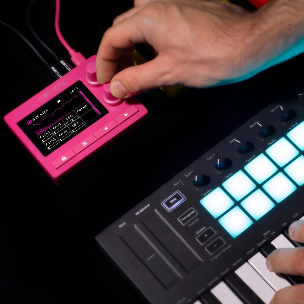 1010music Nanobox Razzmatazz drum machine and sampler with colorful interface, knobs, and buttons for music production.
