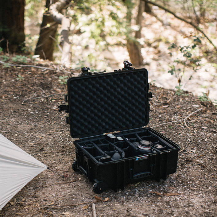 Black B&W Cases Type 6700 video equipment divider system inside a protective bag, organizing gear with foam padding.