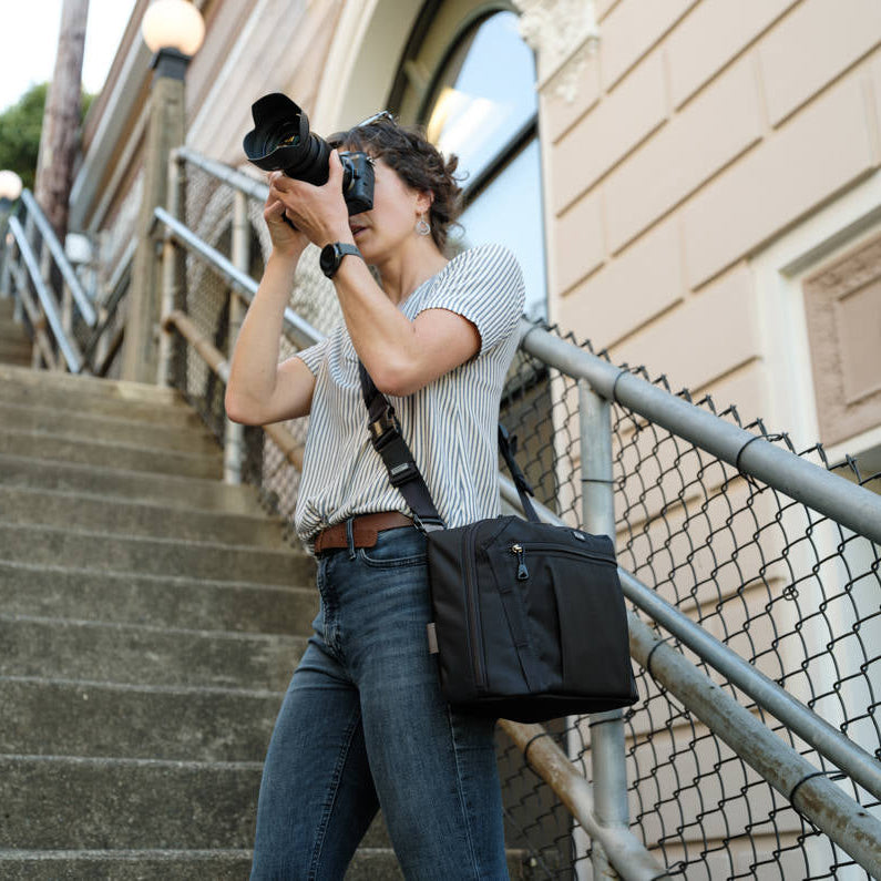 Think Tank PressPass video equipment bag with padded compartments and adjustable strap for professional camera gear storage.