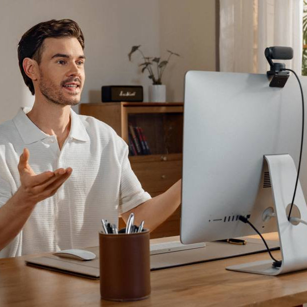 Insta360 Link 2 Pro video conferencing camera with adjustable lens and sleek design for high-quality virtual meetings.
