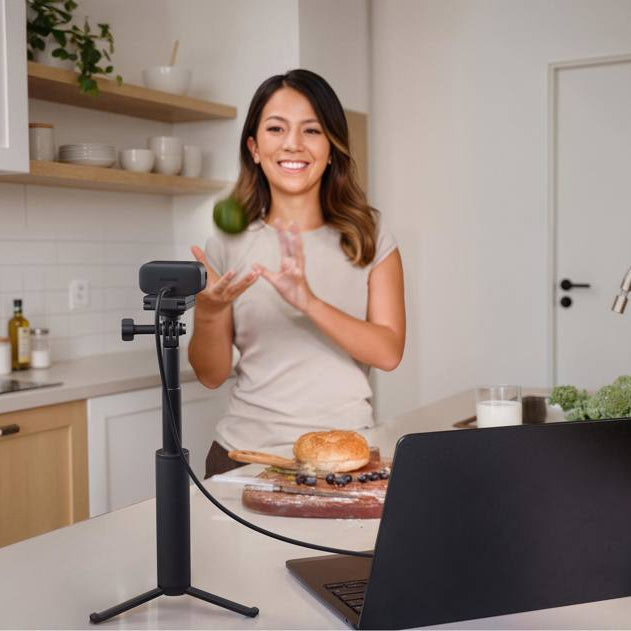 Insta360 Link 2C Pro video conferencing camera with adjustable lens and built-in microphone, designed for professional virtual meetings.