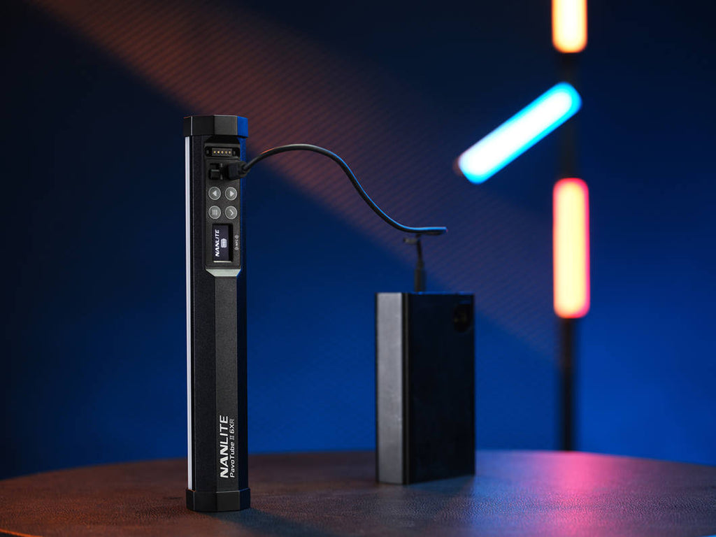 Nanlite PavoTube II 6XR LED RGBWW pixel tube light showing colorful illuminated light sticks against a dark background.