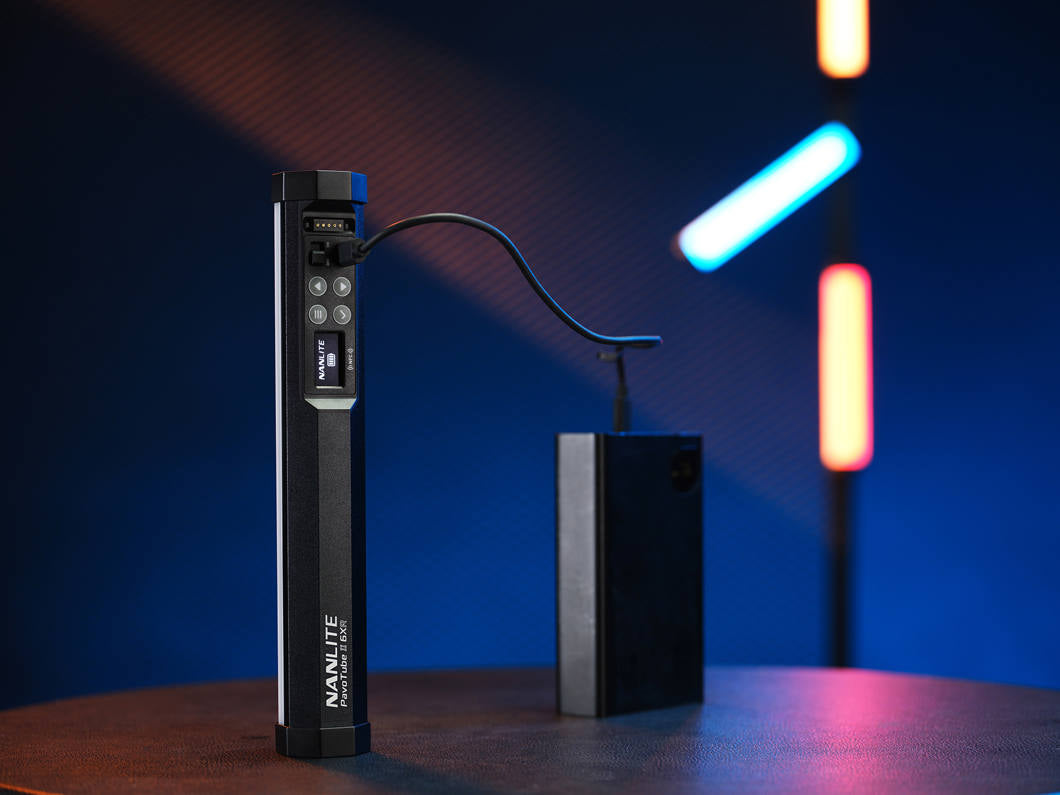 Nanlite PavoTube II 6XR LED RGBWW pixel tube light showing colorful illuminated light sticks against a dark background.