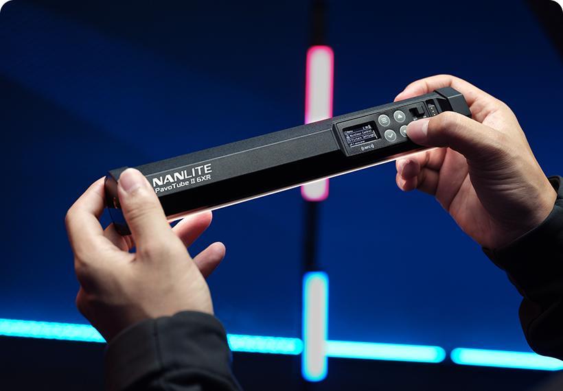 Nanlite PavoTube II 6XR LED RGBWW pixel tube light showing colorful illuminated light sticks with control panel and flexible design.