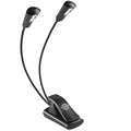 K&M 12244 music stand light attached to a music stand, adjustable LED light with flexible arm for sheet music illumination.