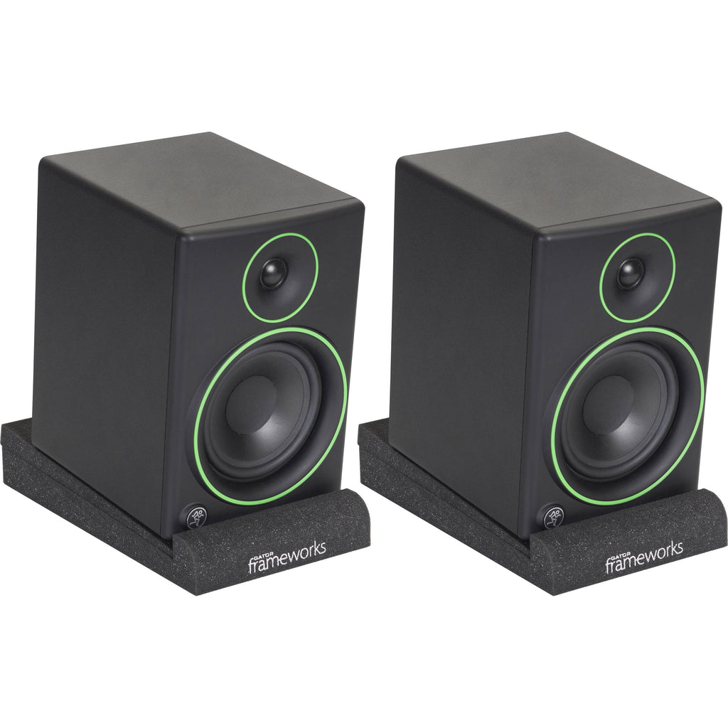 Gator Studio Monitor Isolation Pads placed on studio monitor stands, designed to reduce vibrations and improve sound quality.