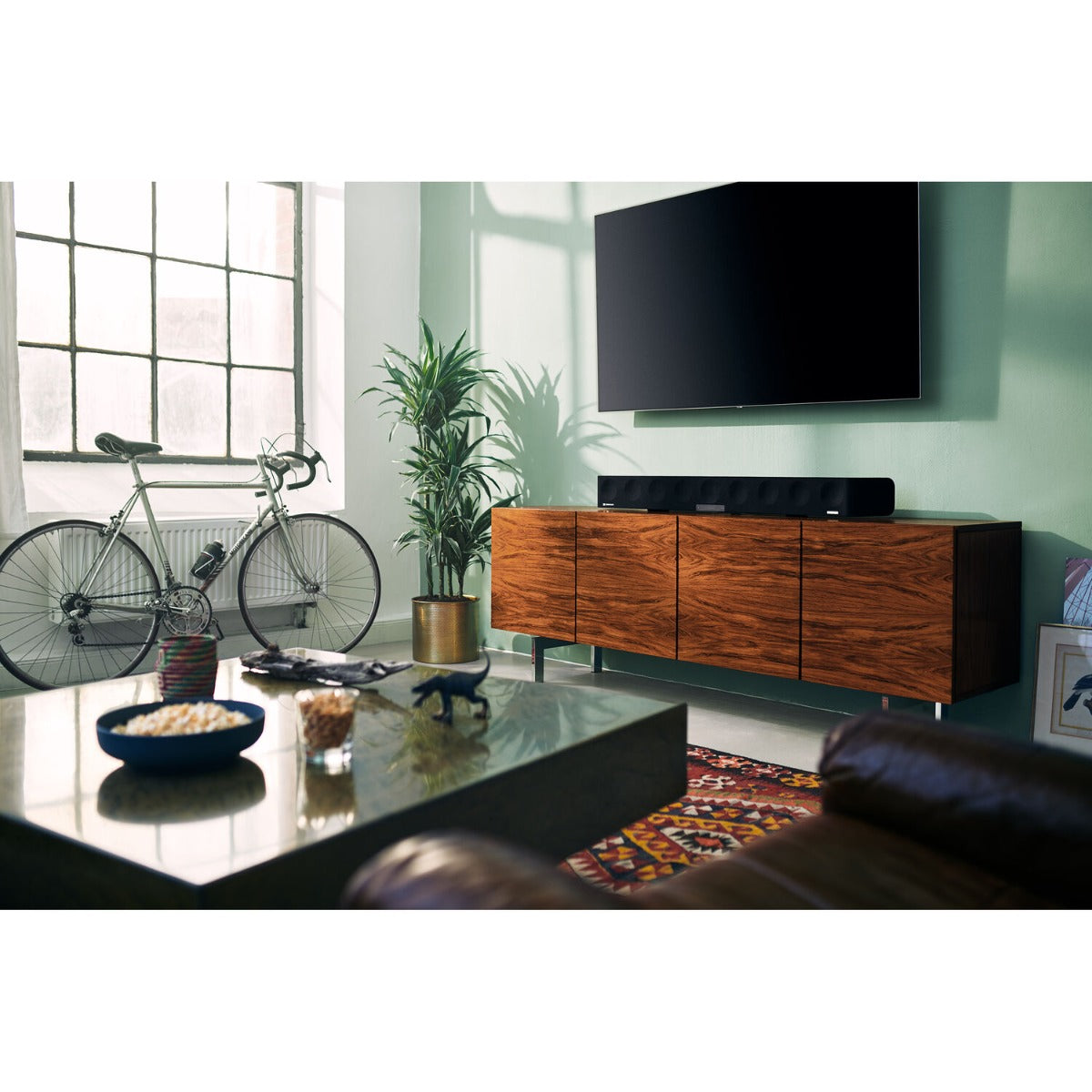 Sennheiser Ambeo Soundbar Max displaying sleek black design with multiple speaker drivers and control buttons on top.