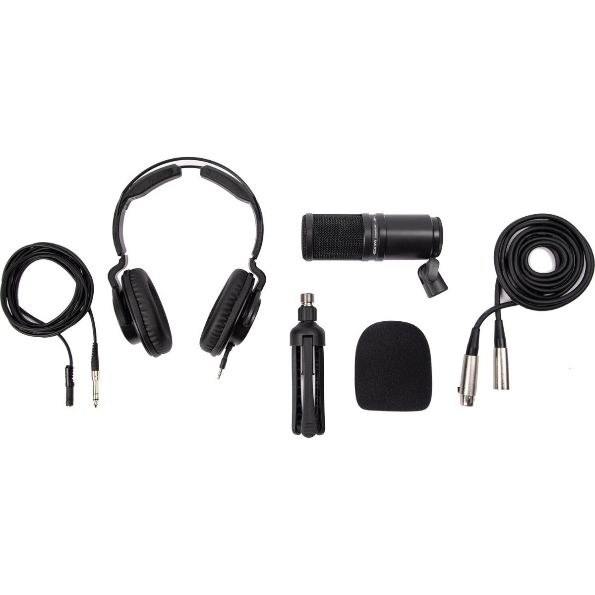 Zoom ZDM-1 Podcast Mic Pack studio bundle featuring microphone, pop filter, and adjustable mic stand on a wooden surface.