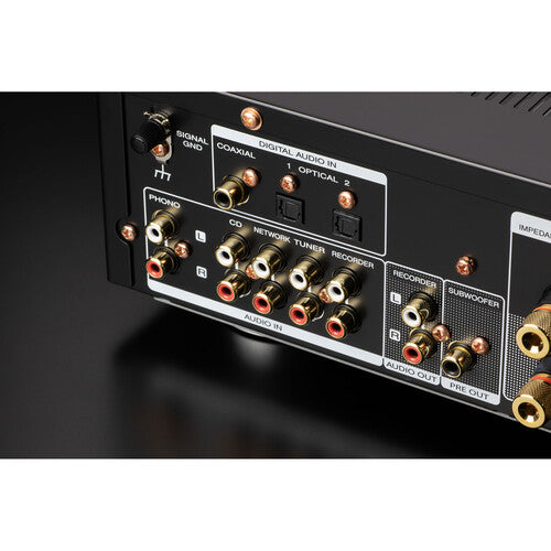 Marantz PM6007 stereo amplifier with controls and display, showcasing its sleek black design and input options.