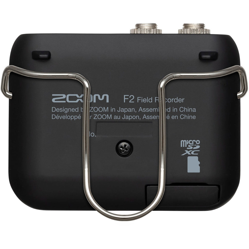 Zoom F2 digital recorder with compact design, featuring multiple input options and a built-in microphone for professional audio recording.
