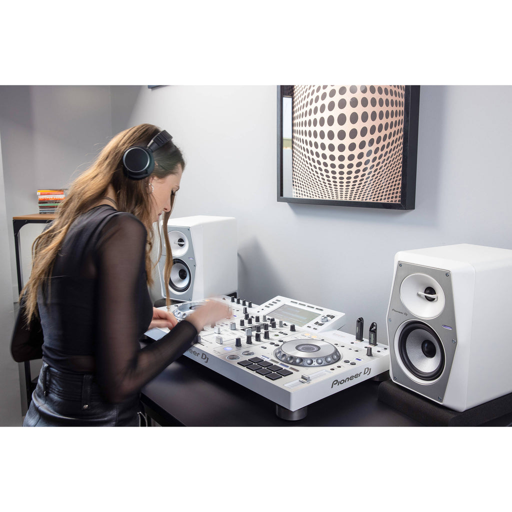Pioneer DJ VM-50 active nearfield monitors with black speaker cabinets and front-facing controls, ideal for studio audio setups.