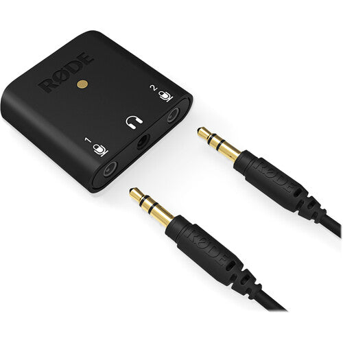 Rode AI-Micro audio interface with compact design, multiple input ports, and connection cables for professional audio recording.