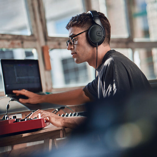 Sennheiser HD 400 Pro studio headphones with over-ear design and adjustable headband, shown in black.