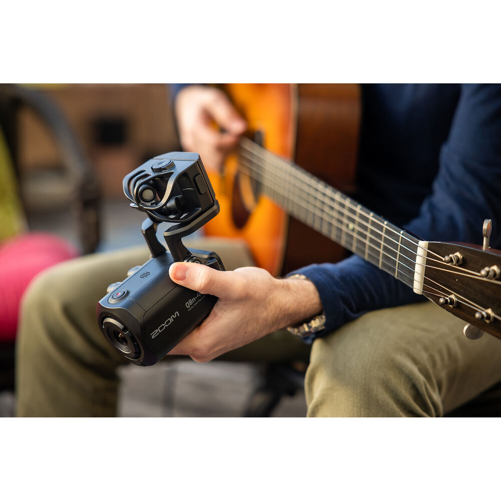 Zoom Q8n-4K video camera with handheld design, multiple control buttons, and built-in microphone for high-quality recording.