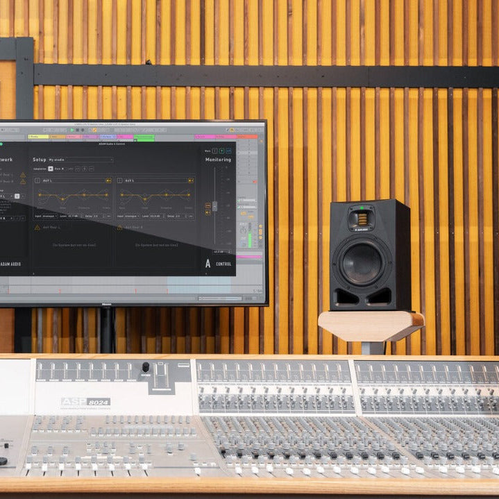 Adam Audio A7V active nearfield monitor showing its sleek black speaker with brand logo and detailed front grille.