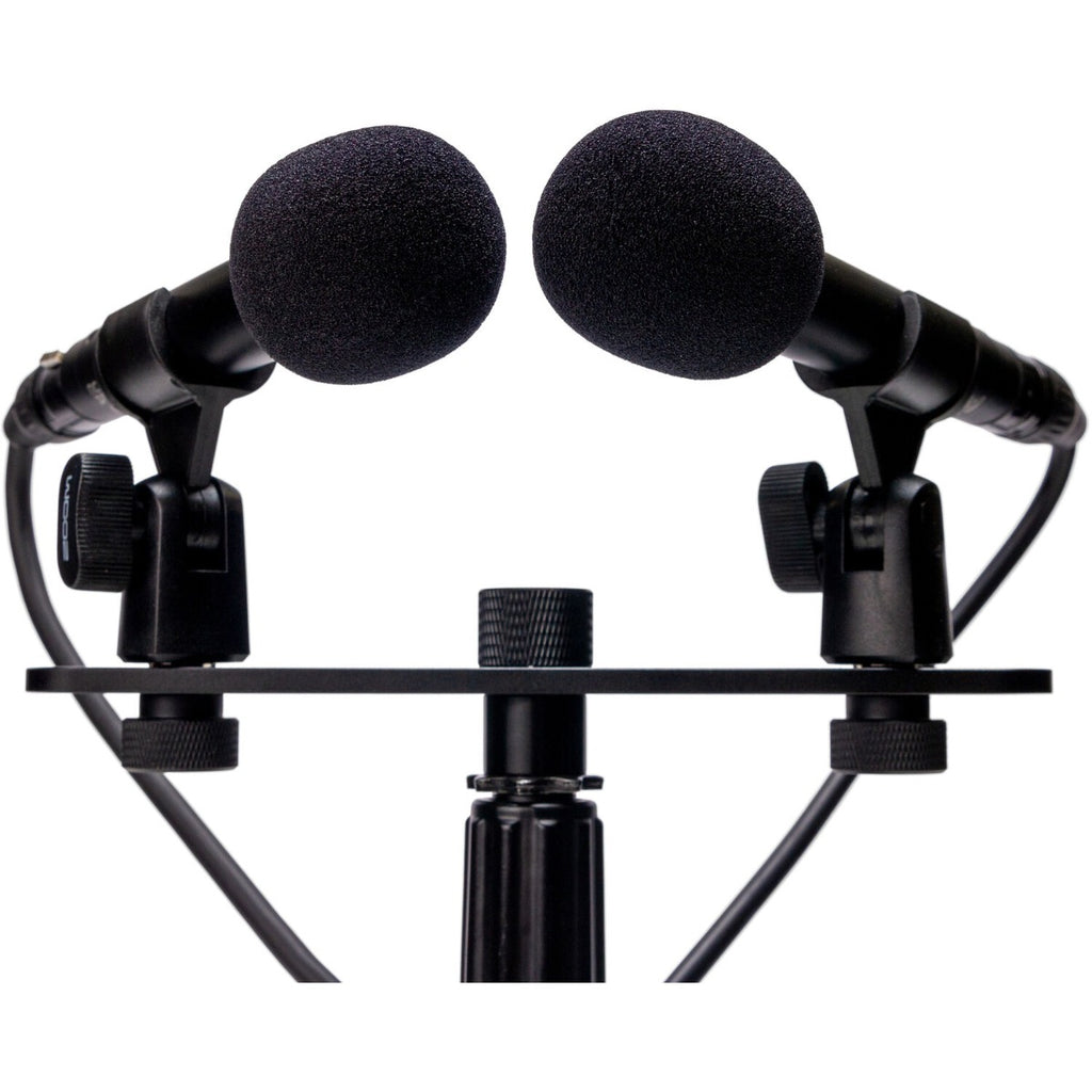 Zoom ZPC-1 shotgun microphone attached to a camera, showcasing its sleek design and professional audio recording capabilities.