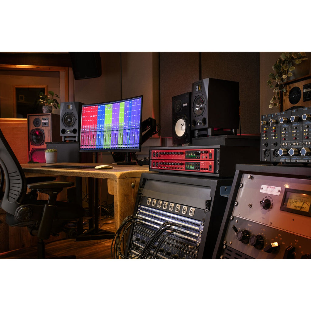 Focusrite Clarett+ OctoPre microphone preamp interface with multiple input channels and control knobs visible.