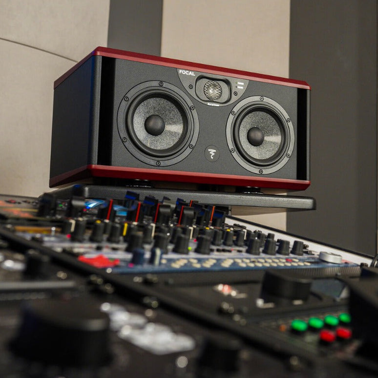 Focal Twin6 studio monitors with a sleek black design and dual woofers, ideal for professional audio production.