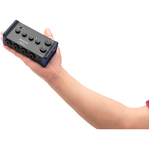 Zoom AMS-44 audio interface with multiple input/output options and a sleek design, showcasing its front panel and controls.