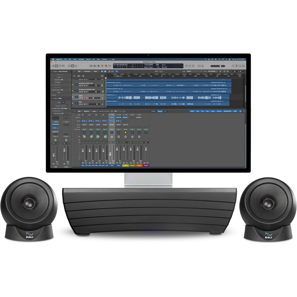 Pair of Kali Audio IN-UNF studio monitors with a subwoofer in a professional music production setup.