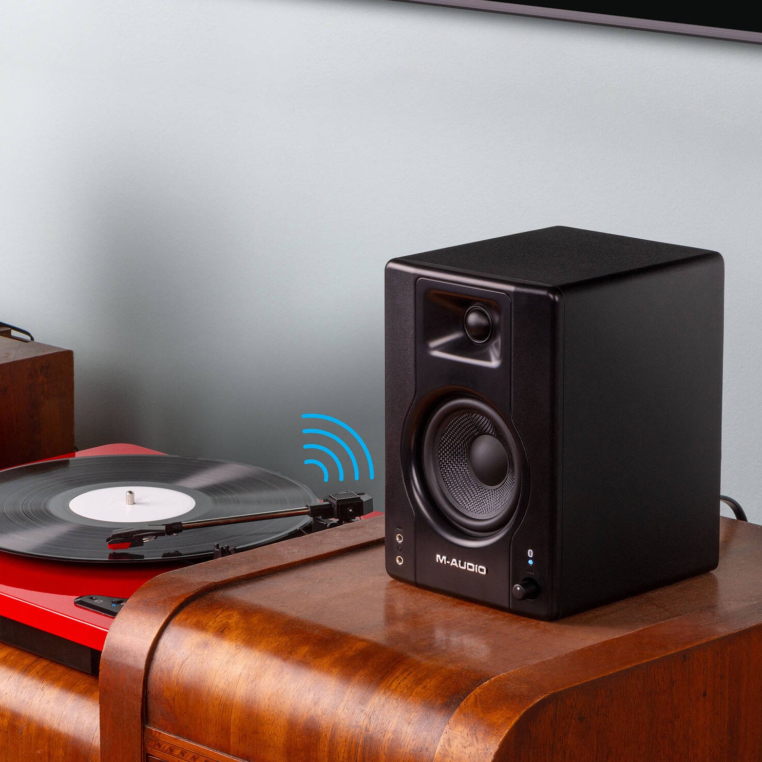M-Audio BX3 BT desktop speakers with black finish, featuring control knobs and Bluetooth connectivity on a white surface