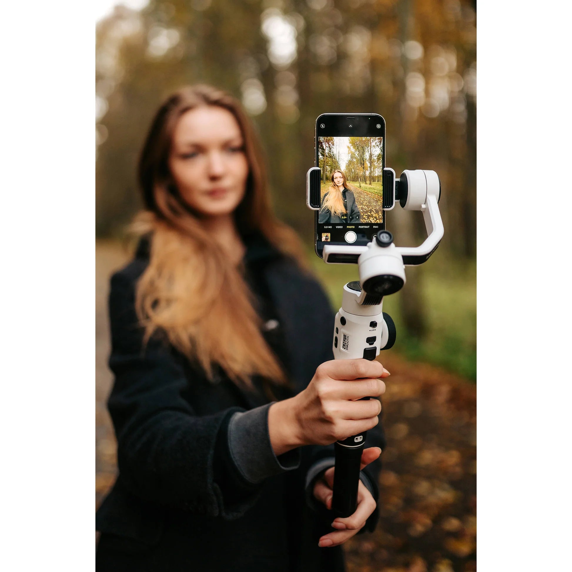 Zhiyun Smooth 5S handheld gimbal stabilizer for smartphones, featuring ergonomic design and adjustable tilt for smooth filming.