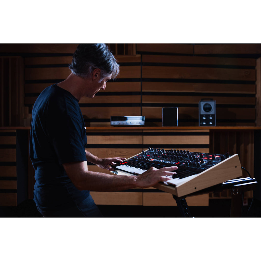 Sequential Trigon-6 synthesizer with a sleek control panel, multiple knobs, and patch points for versatile sound creation.