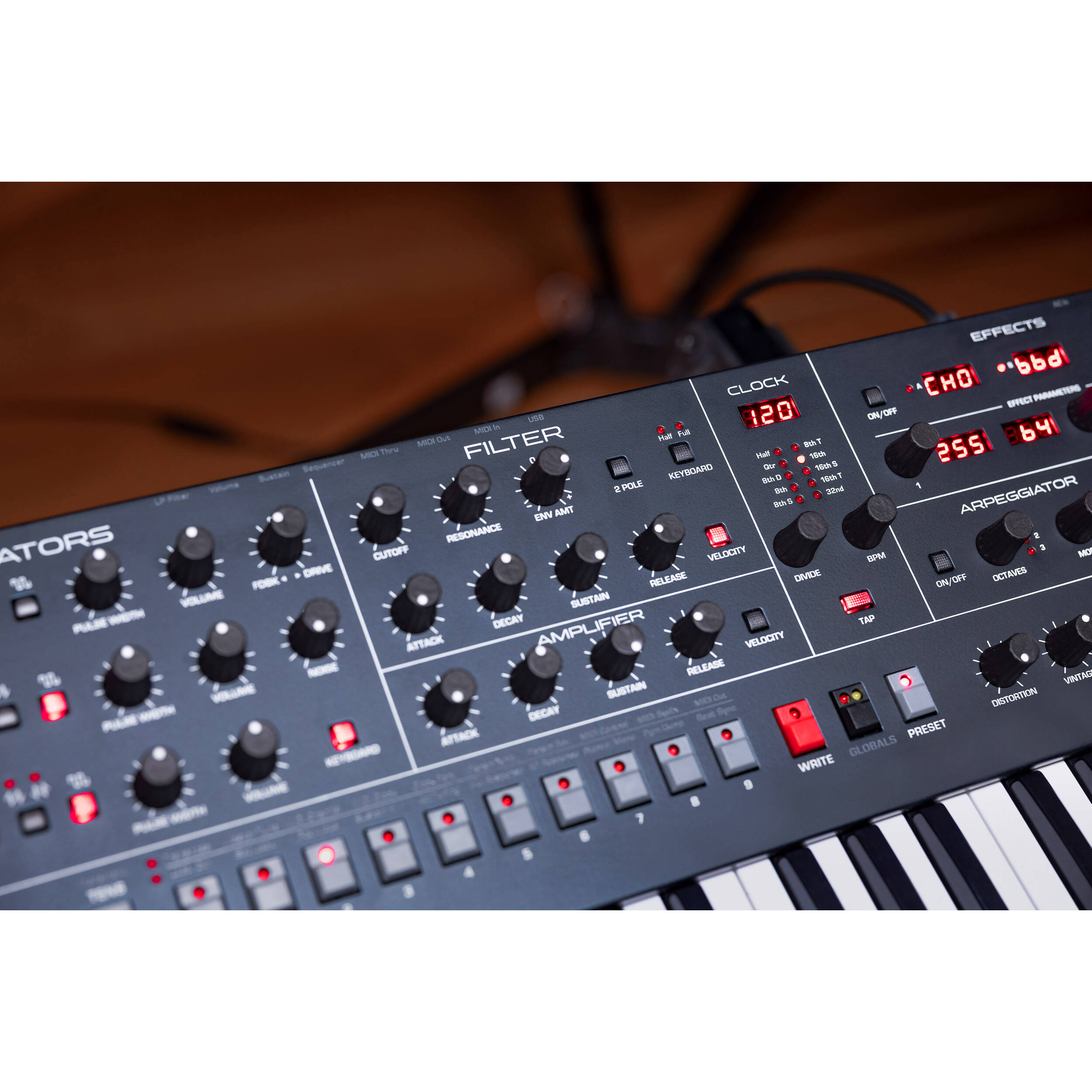 Sequential Trigon-6 synthesizer with a sleek control panel and multiple knobs and switches for sound shaping.