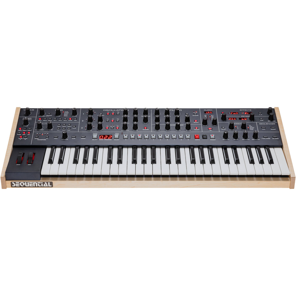 Sequential Trigon-6 synthesizer with multiple knobs and buttons, showing its compact electronic keyboard layout.
