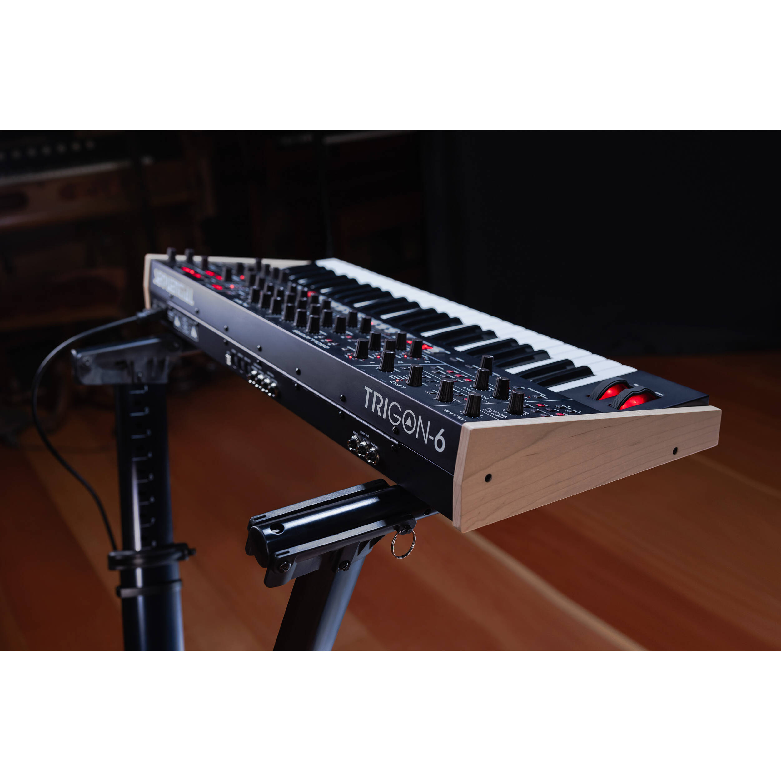 Sequential Trigon-6 synthesizer with a sleek black control panel, multiple knobs and patch points for modular sound design.