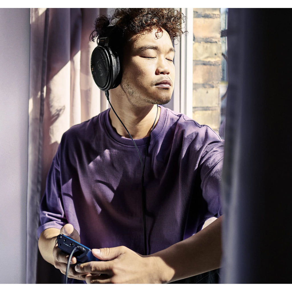 Open-back Sennheiser HD 660S2 Head-Fi headphones with large ear cups and metal accents, designed for high-fidelity audio.