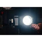 Zhiyun Molus X100 Bi-Color LED lights in a combo pack with adjustable panels and light controls, ideal for professional lighting setups.