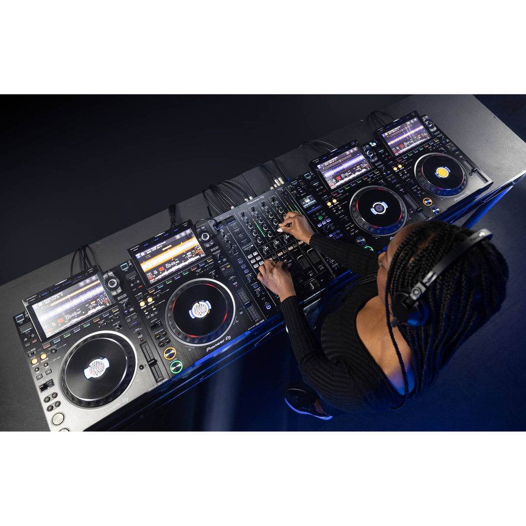 Pioneer DJM-A9 DJ mixer with multiple knobs, faders, and input channels for professional audio mixing.