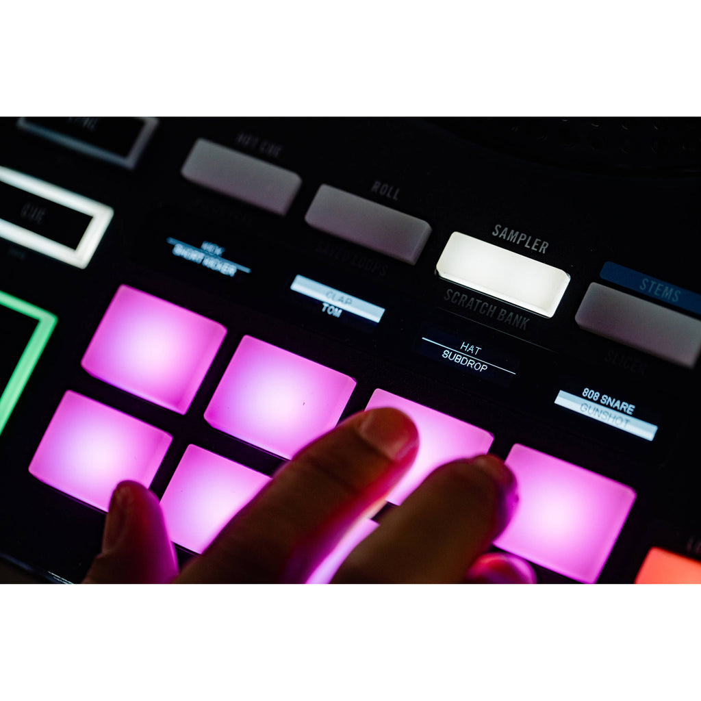 Rane Four DJ controller with professional jog wheels, mixer controls, and multiple input options for DJ mixing and performance.