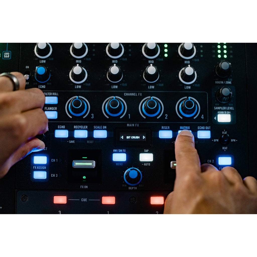 Rane Four DJ controller with multiple knobs, buttons, and jog wheels for professional DJ mixing and performance.