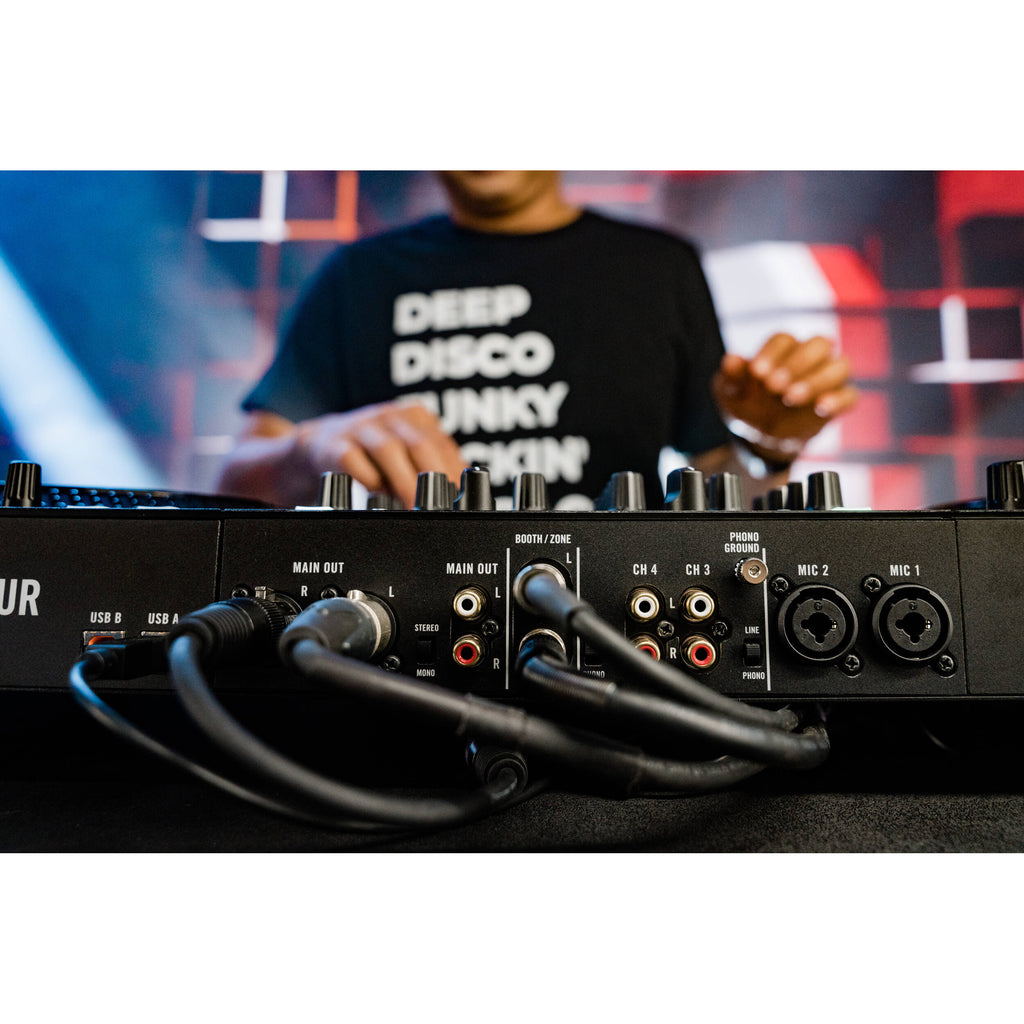 Rane Four DJ controller with jog wheels, faders, and control knobs on a black surface for professional DJ mixing.