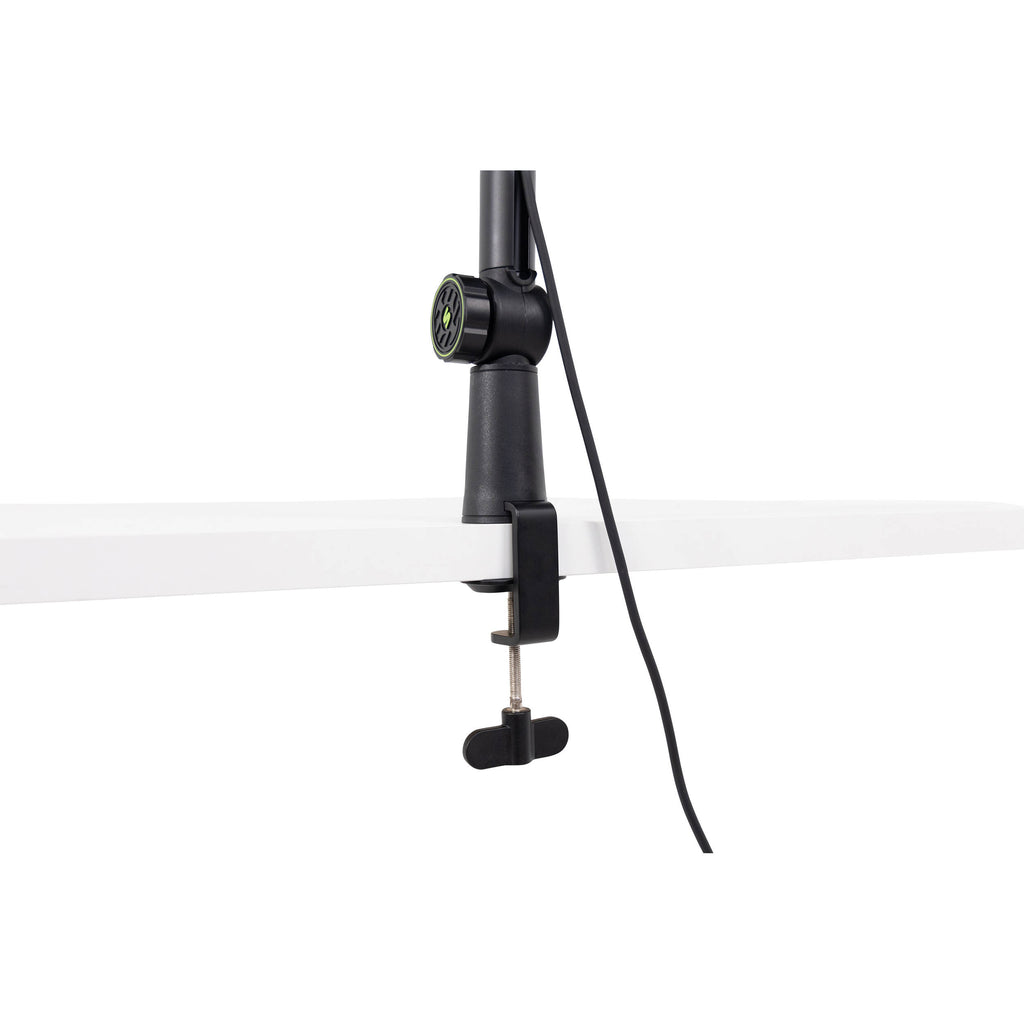 Shure SH-BROADCAST1 broadcast microphone arm mounted on a desk with a microphone attached for professional audio recording.