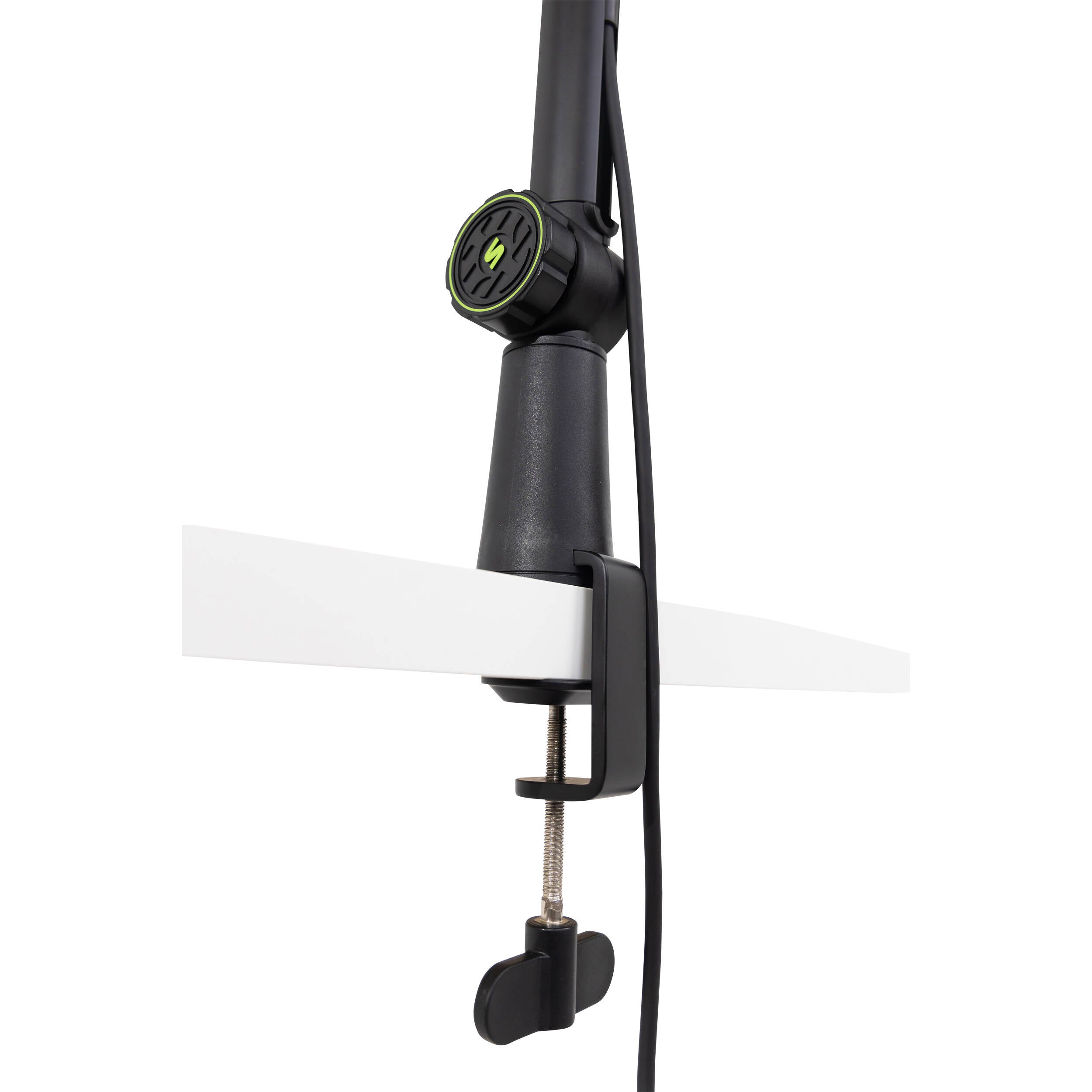 Shure SH-BROADCAST1 broadcast microphone arm mounted on a desk, adjustable metal arm for professional audio setup.