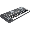 UDO Audio Super 6 synthesizer keyboard with multiple knobs and keys, showcasing its sleek black design and control panel.