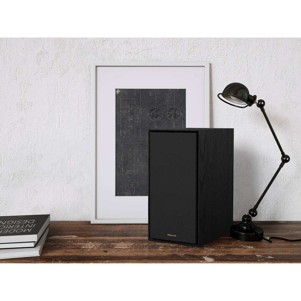 Black Klipsch R-50PM wireless speakers with sleek design and built-in controls, perfect for high-quality audio in any space.