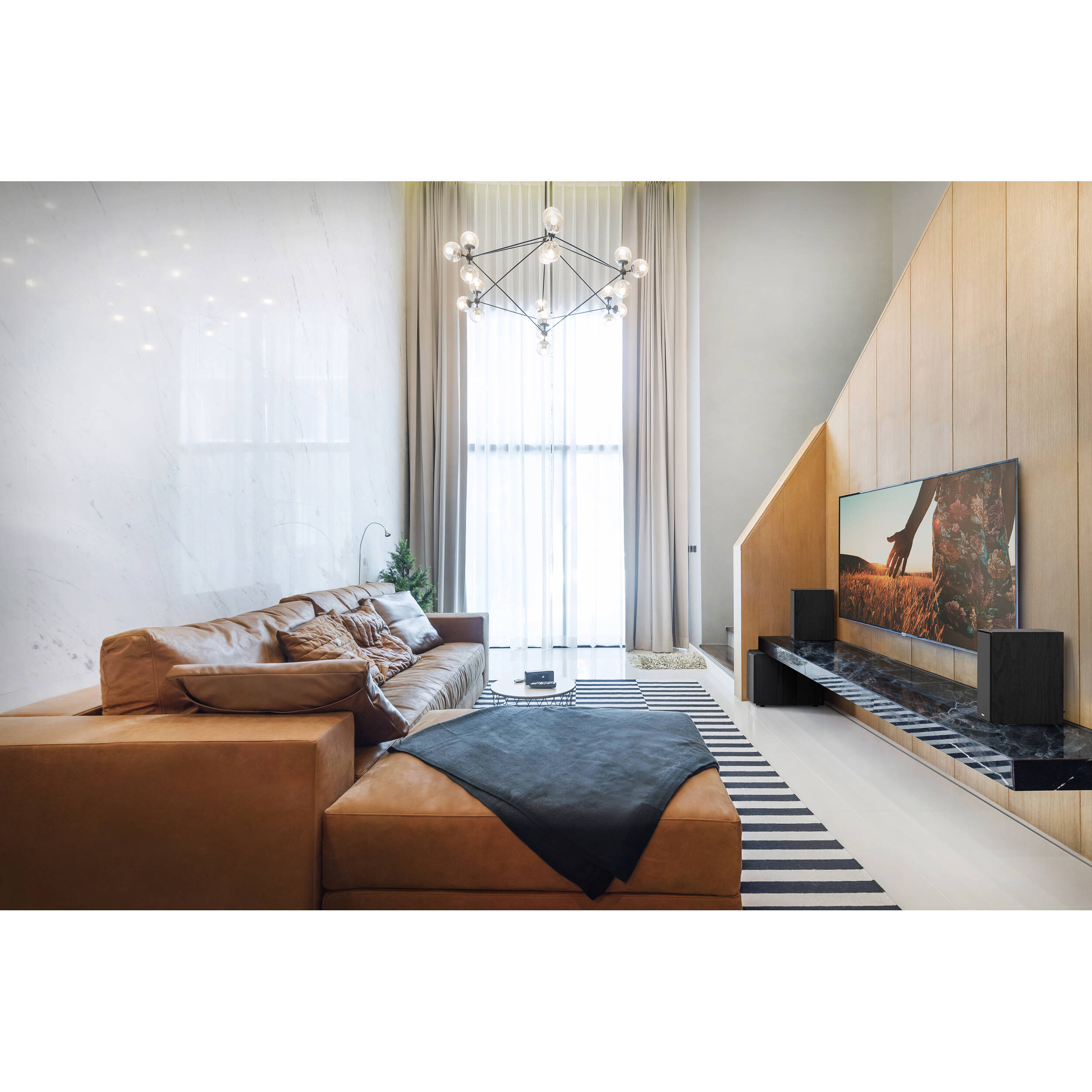 Black Klipsch R-50PM wireless speakers with sleek design and front-facing controls, ideal for high-quality audio in modern setups.