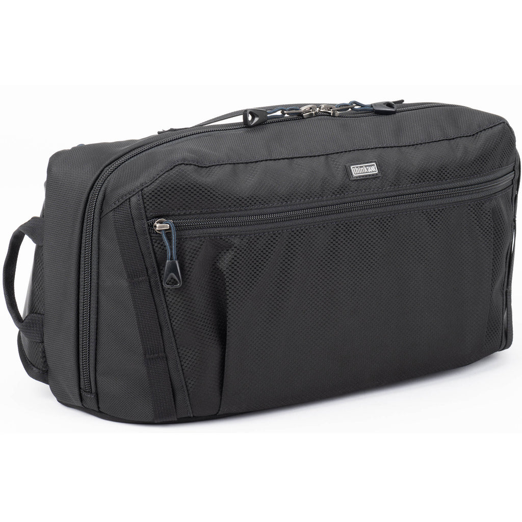 Think Tank PressPass Sling Bag for video equipment, black nylon with adjustable strap and multiple compartments.