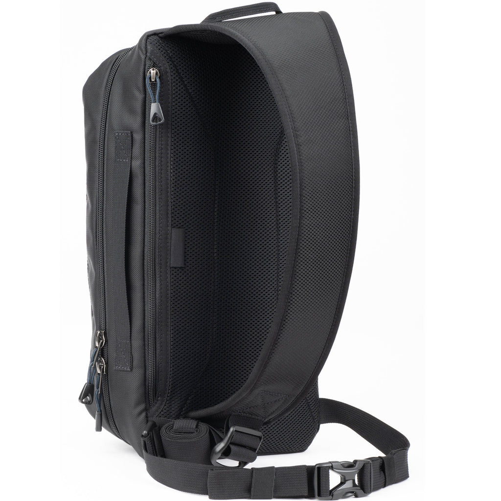 Think Tank PressPass Sling Bag for video equipment, showing padded compartments and adjustable strap on black fabric.