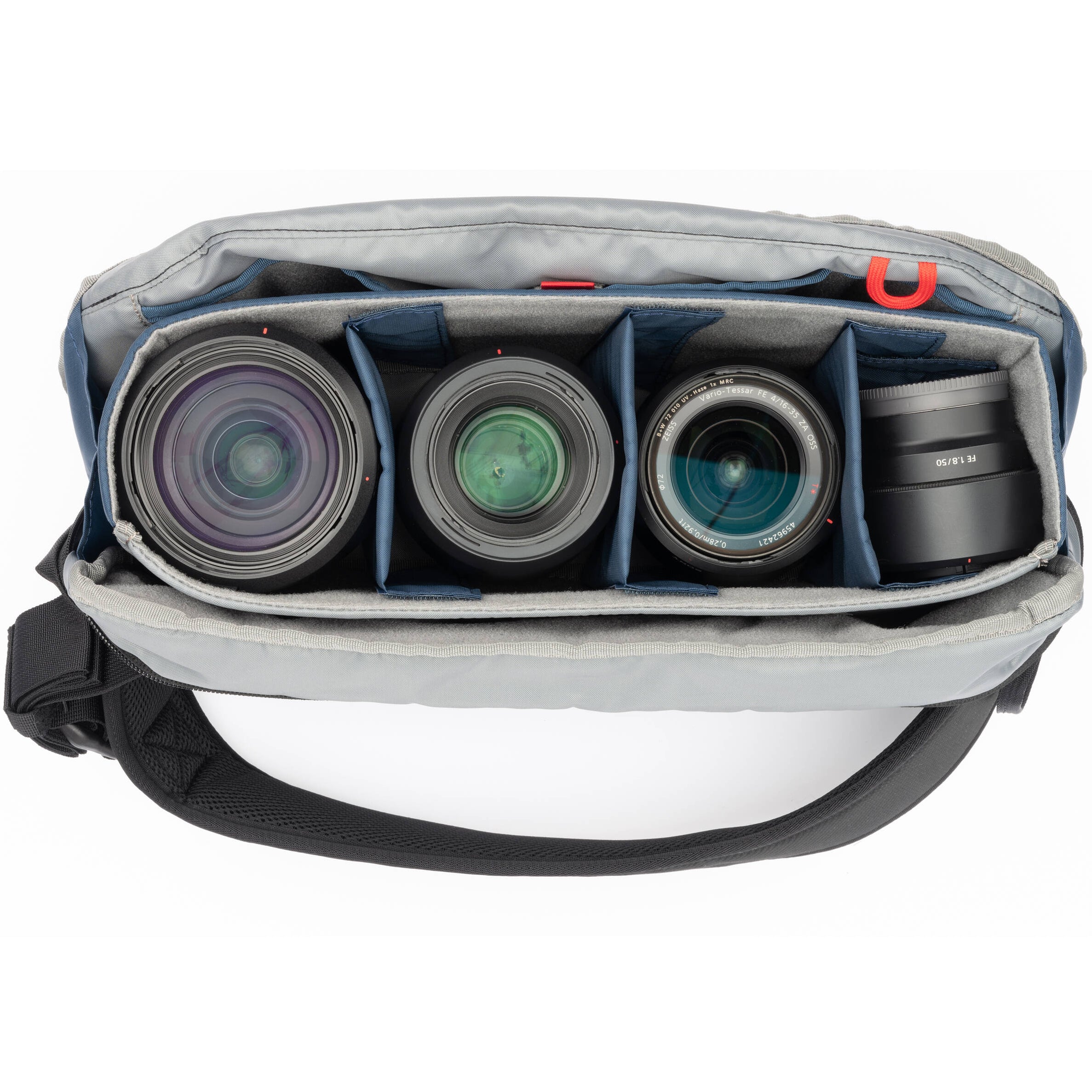 Think Tank PressPass Sling Bag for video equipment, showing durable black case with adjustable strap and multiple compartments.